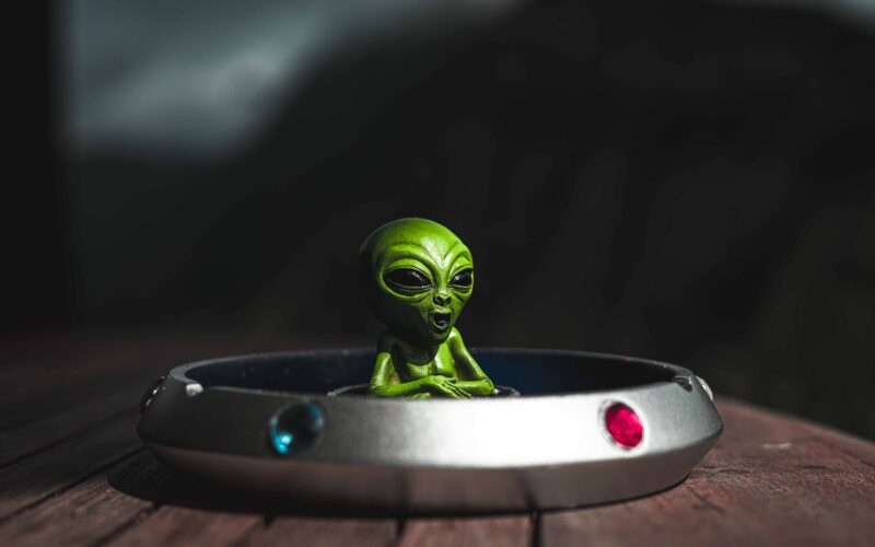 ashtray with an alien toy inside